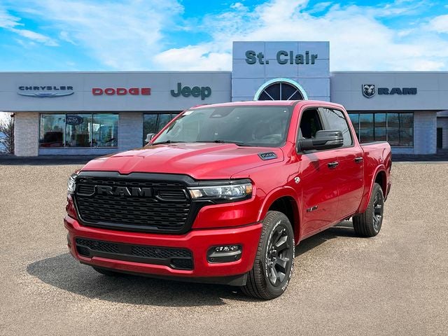 2026 RAM Ram 1500 RAM 1500 BIG HORN CREW CAB 4X4 5'7' BOX in Molten Red Pearl-Coat Exterior Paint — front three-quarter view