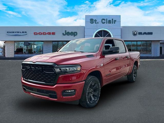 2026 RAM Ram 1500 RAM 1500 BIG HORN CREW CAB 4X4 5'7' BOX in Molten Red Pearl-Coat Exterior Paint — front three-quarter view